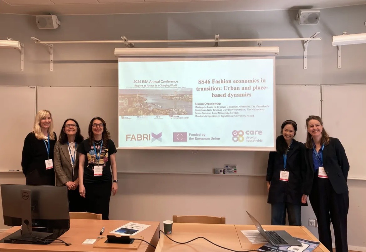 Five researchers standing in front of the presentation screen for the special session on fashion economies at the 2026 RSA Annual Conference