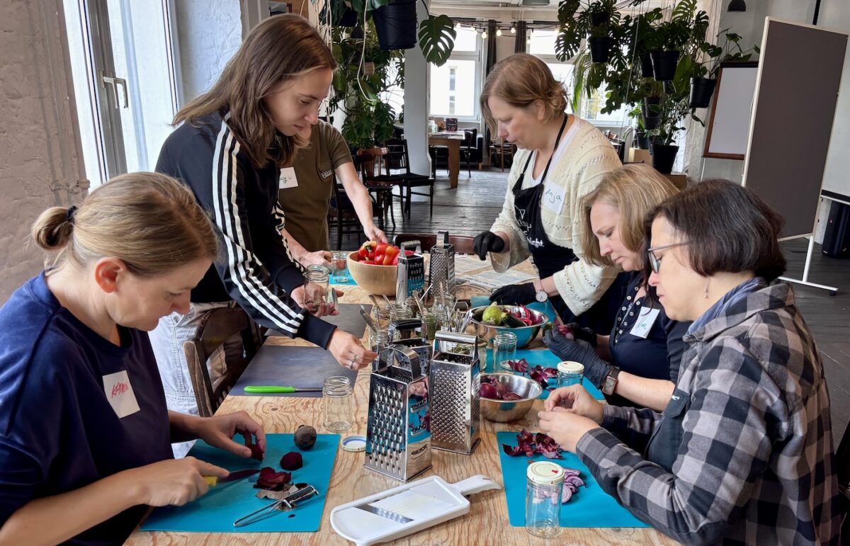 CARE participants preparing vegetables for pickling and fermentation during a workshop in Berlin